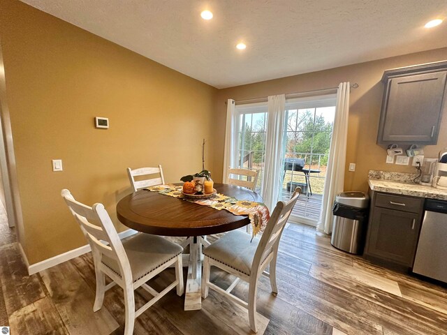 dining area with hardwood / wood-style flooring