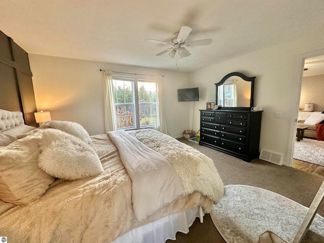 carpeted bedroom featuring ceiling fan