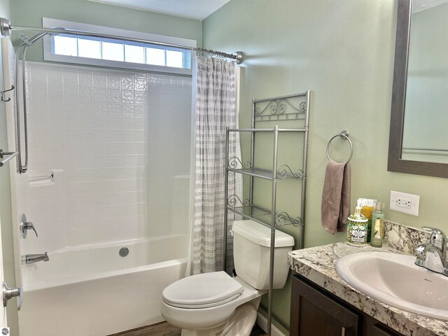 full bathroom with vanity, toilet, and shower / bath combo