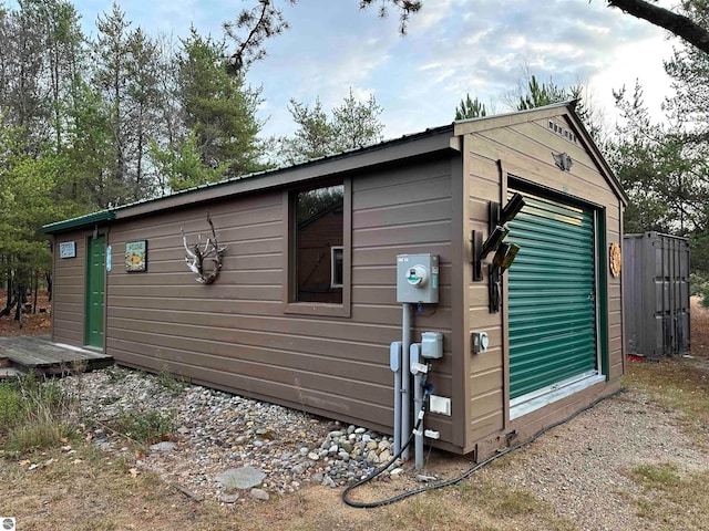 view of side of property with an outbuilding