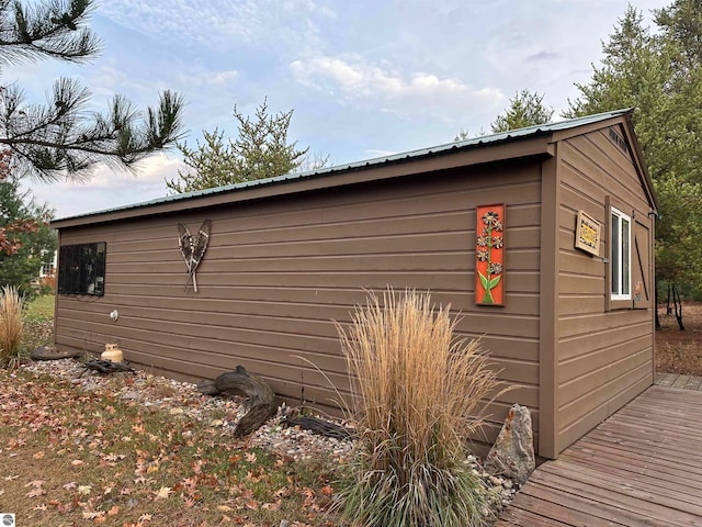 view of side of property featuring a deck