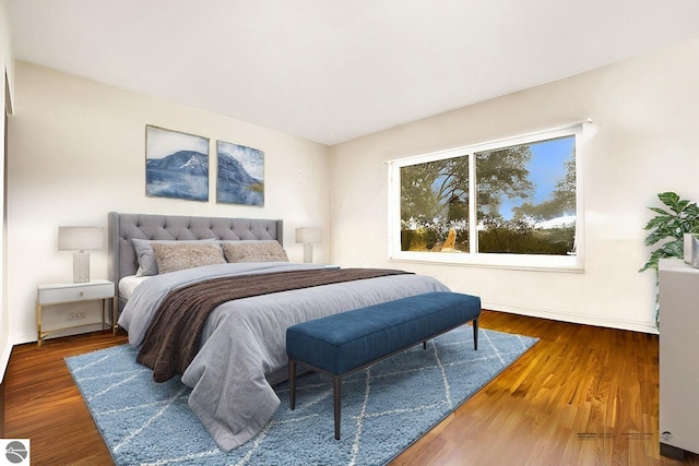 bedroom featuring dark hardwood / wood-style flooring