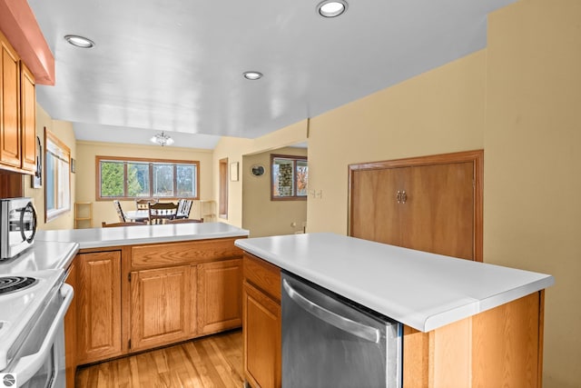 kitchen with a center island, light hardwood / wood-style flooring, and stainless steel appliances