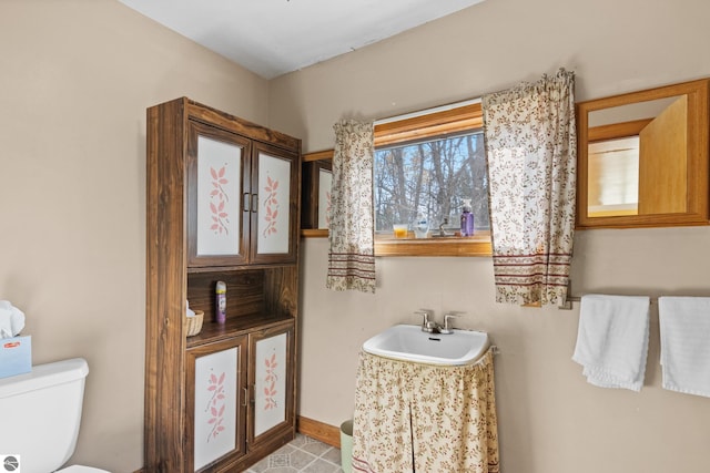 bathroom with toilet and sink