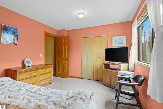 carpeted bedroom featuring a closet