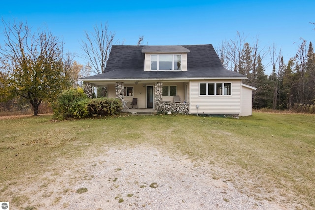 view of front facade featuring a front lawn and covered porch