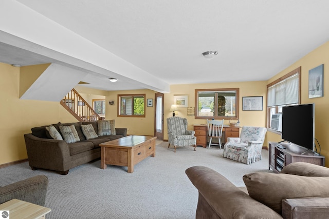 carpeted living room featuring a healthy amount of sunlight