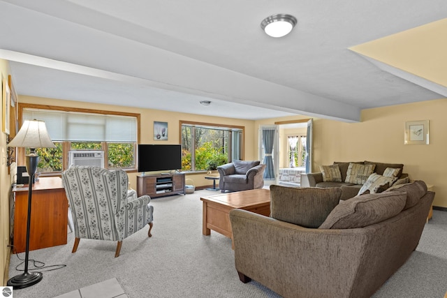 carpeted living room featuring beamed ceiling and cooling unit