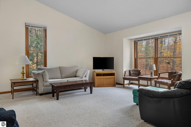 living room with carpet floors and vaulted ceiling