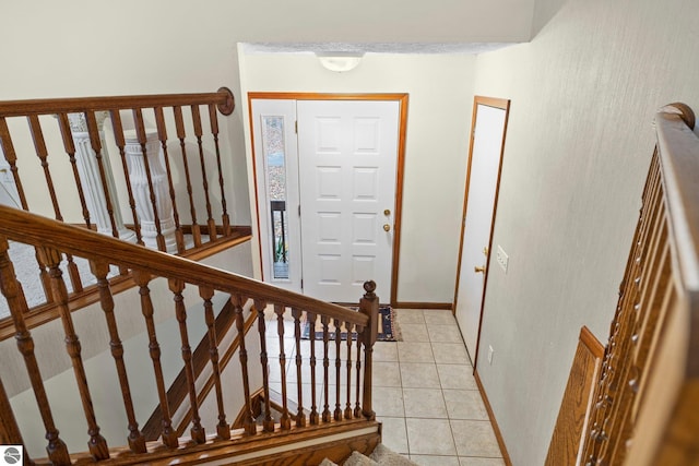 entrance foyer featuring light tile patterned floors