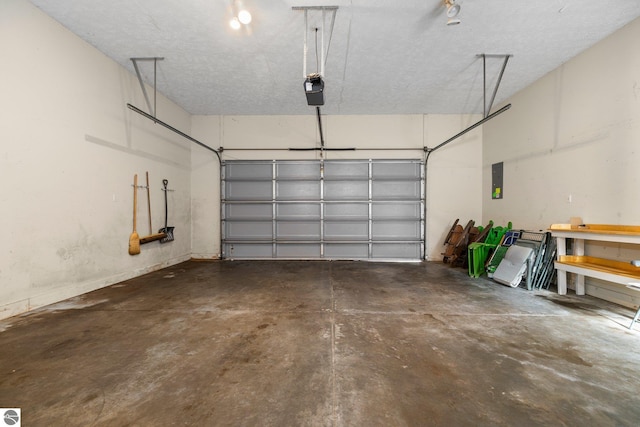 garage with electric panel and a garage door opener