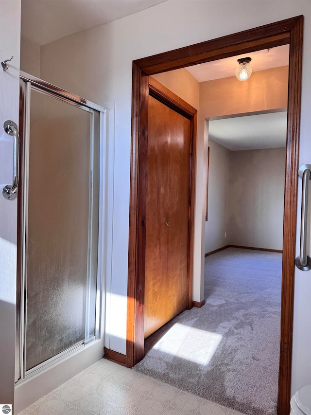 corridor with light colored carpet