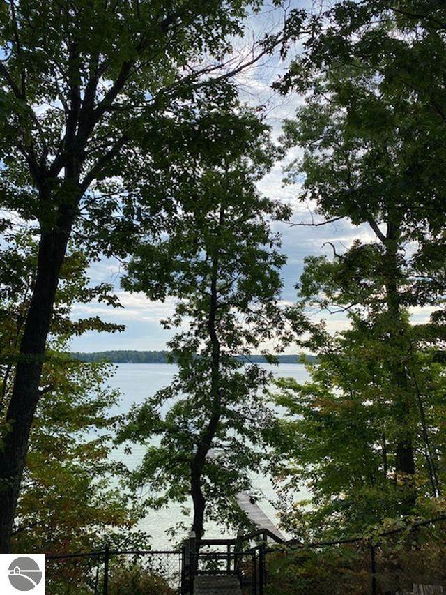 4709 State Park Hwy, Interlochen, MI 49643 - water view featuring fence