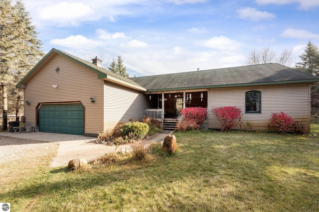 ranch-style house featuring a garage, a front yard, and covered porch