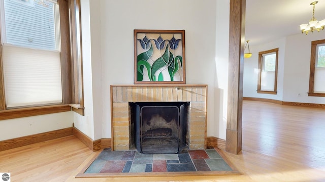 interior details featuring a chandelier and wood-type flooring