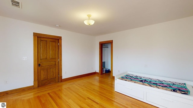 unfurnished bedroom with wood-type flooring