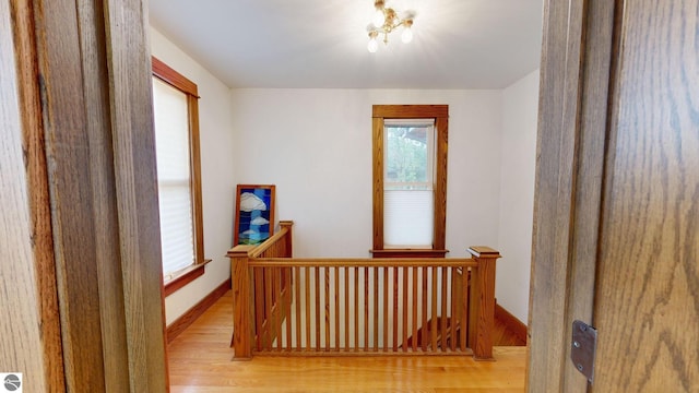 hall with light hardwood / wood-style flooring