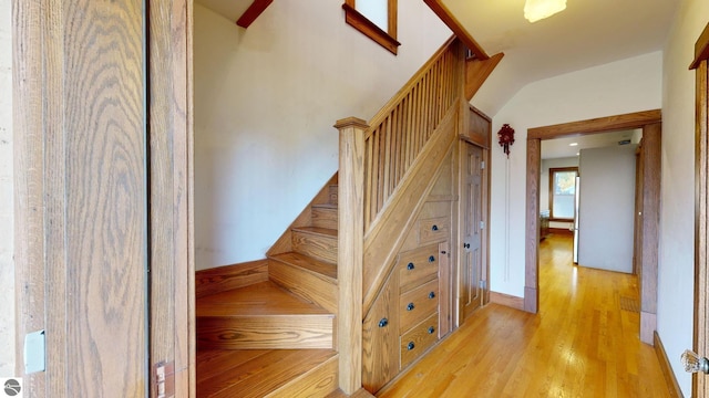 stairs with hardwood / wood-style floors