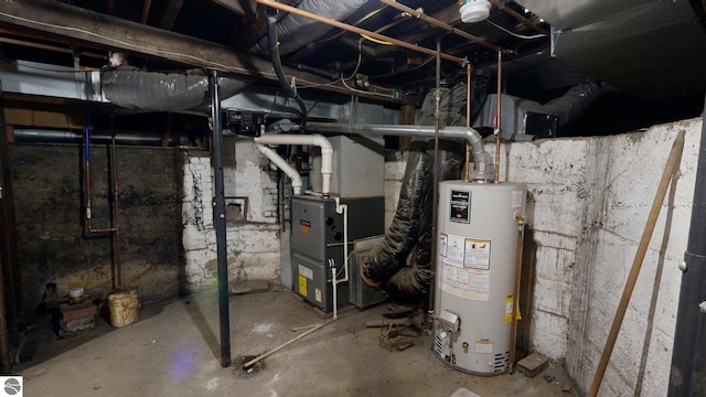 utility room with heating unit and gas water heater