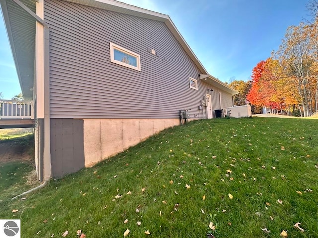 view of home's exterior featuring a yard