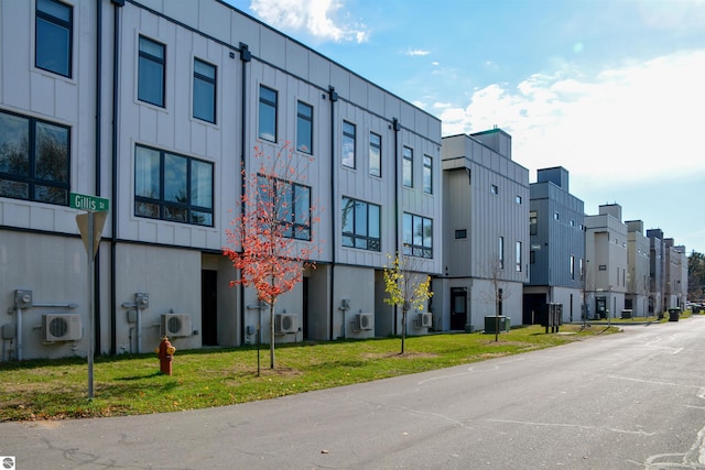 view of building exterior featuring ac unit and central air condition unit