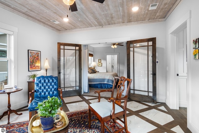 interior space with ceiling fan, french doors, and wood ceiling