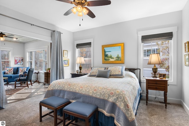 bedroom with ceiling fan and light colored carpet