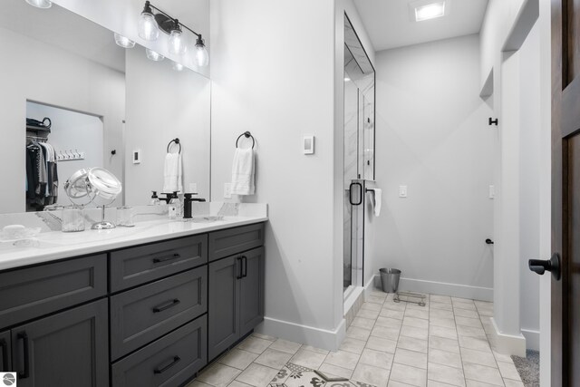 bathroom featuring vanity and a shower with shower door