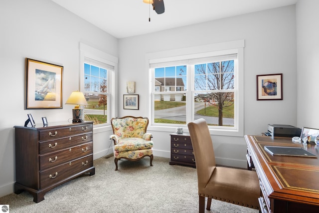 home office featuring ceiling fan and light colored carpet