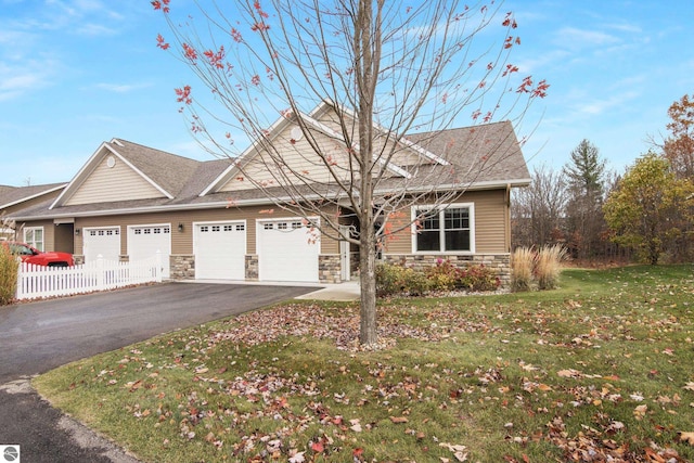 view of front facade with a garage and a front yard