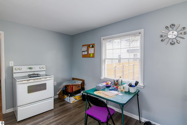 kitchen featuring white range with electric stovetop and dark wood-type flooring