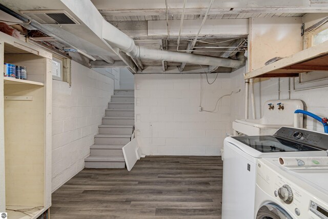 laundry room featuring independent washer and dryer and dark hardwood / wood-style flooring