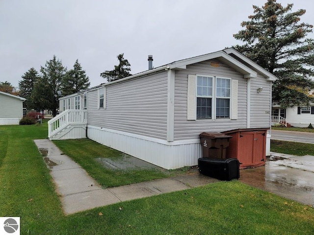 view of home's exterior with a lawn