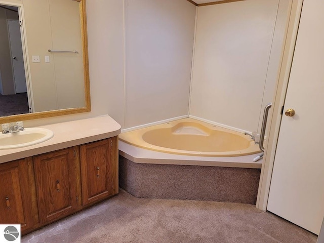 bathroom featuring vanity and a bath