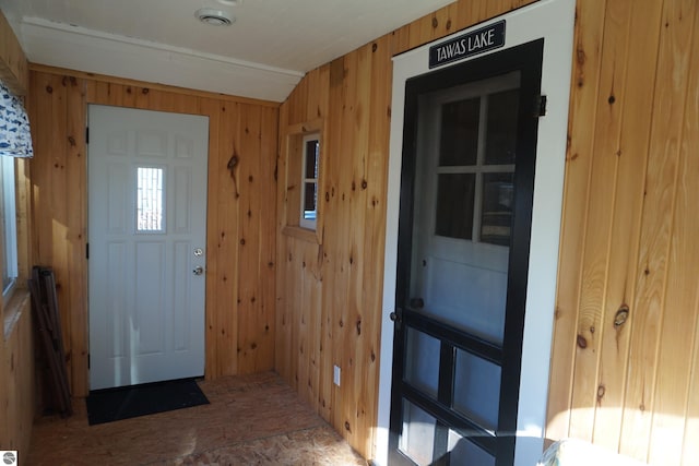 foyer entrance with wood walls