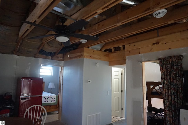 interior space featuring ceiling fan