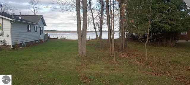 view of yard with a water view