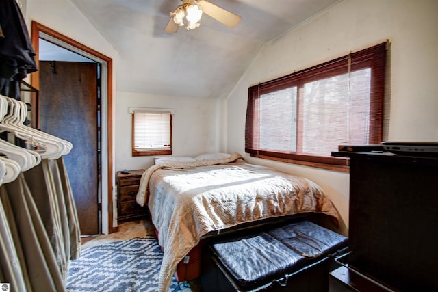 bedroom featuring ceiling fan and vaulted ceiling