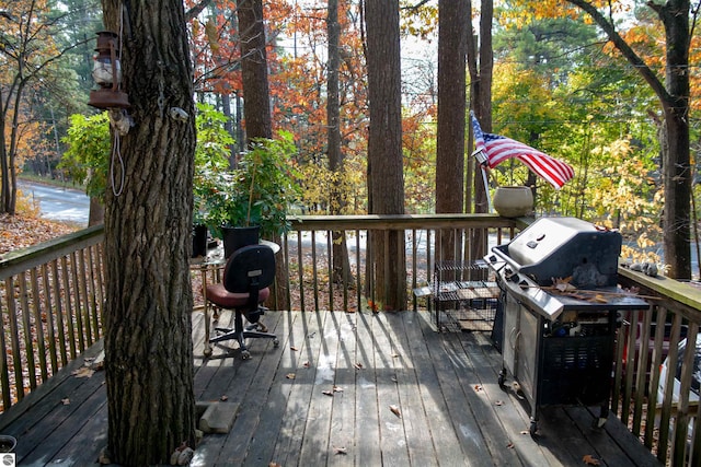 wooden deck featuring grilling area