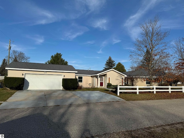 ranch-style house featuring a garage