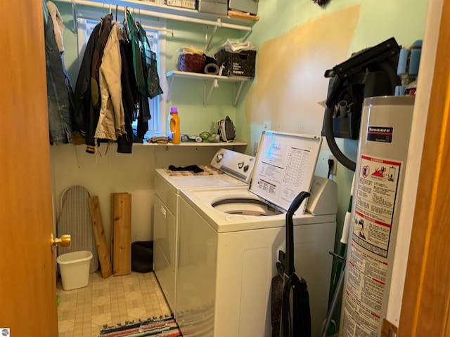 clothes washing area with water heater and independent washer and dryer