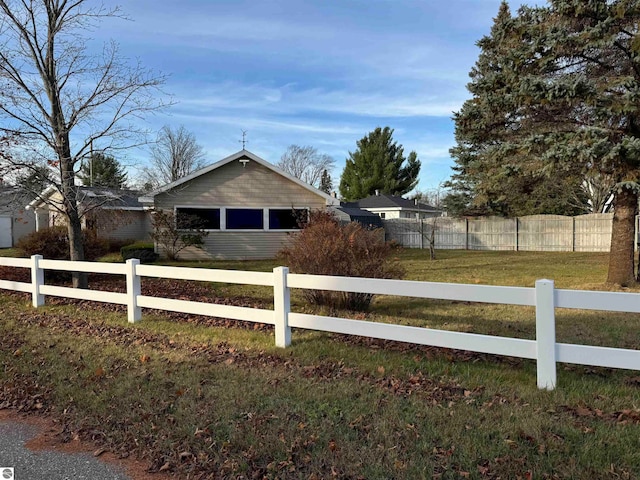 view of property exterior featuring a lawn