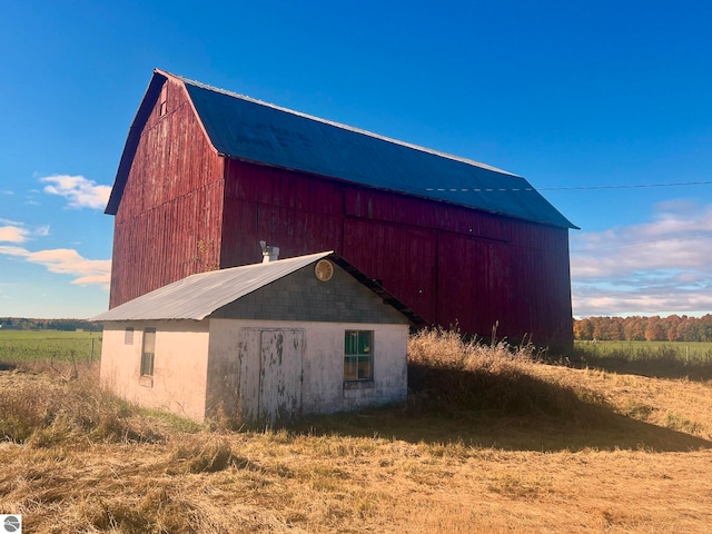 view of outdoor structure with a rural view