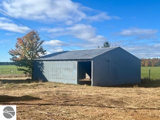 view of outdoor structure featuring a rural view