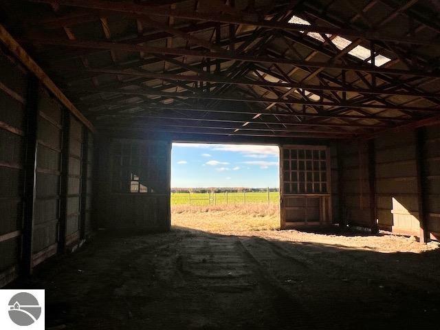 view of stable with a rural view