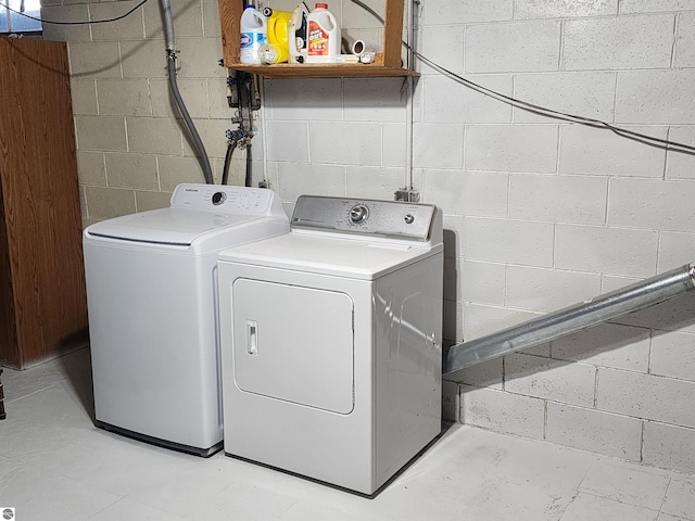 laundry area featuring washing machine and clothes dryer