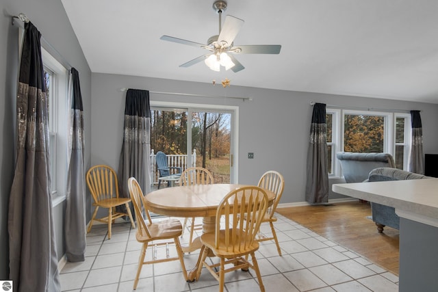 dining area with ceiling fan and light hardwood / wood-style flooring