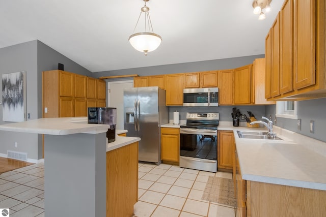 kitchen with sink, appliances with stainless steel finishes, light tile patterned floors, decorative light fixtures, and lofted ceiling