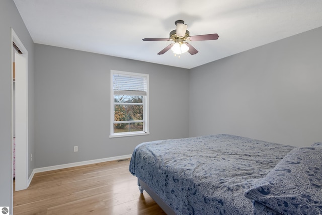 bedroom featuring ceiling fan and light hardwood / wood-style flooring