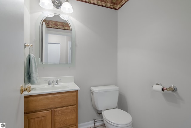 bathroom with toilet and vanity